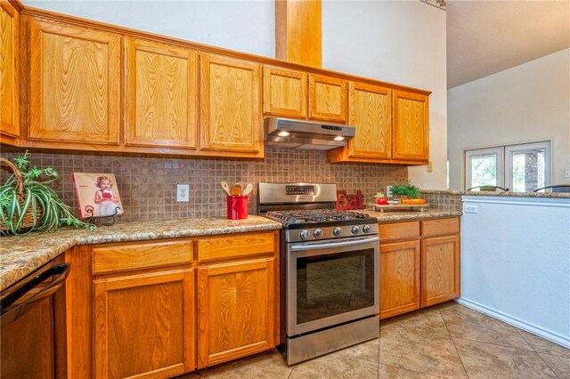 4102 Castle Valley Dr, Corpus Christi, TX 78410 - kitchen featuring gas stove, under cabinet range hood, decorative backsplash, light tile patterned floors, and black dishwasher