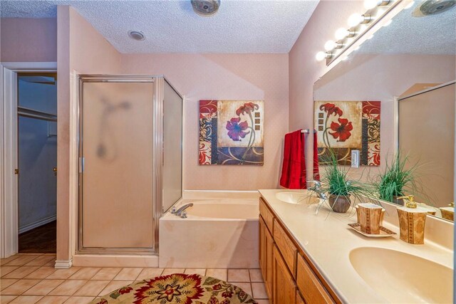 4102 Castle Valley Dr, Corpus Christi, TX 78410 - bathroom with a stall shower, a garden tub, a textured ceiling, and tile patterned floors