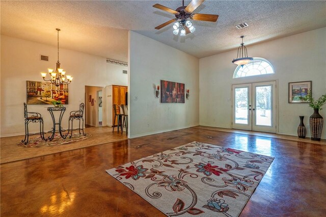 4102 Castle Valley Dr, Corpus Christi, TX 78410 - foyer entrance featuring high vaulted ceiling, a textured ceiling, french doors, finished concrete floors, and a chandelier