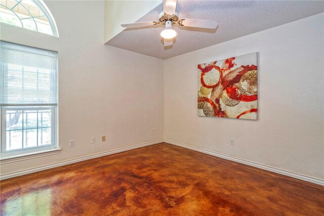 4102 Castle Valley Dr, Corpus Christi, TX 78410 - empty room featuring baseboards, concrete flooring, and a ceiling fan
