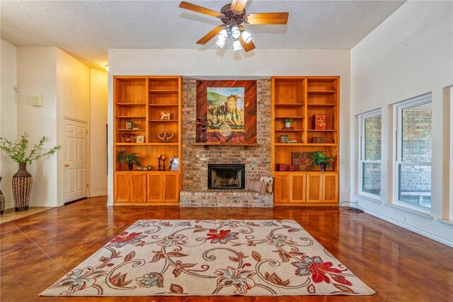 4102 Castle Valley Dr, Corpus Christi, TX 78410 - living room with a textured ceiling, a brick fireplace, ceiling fan, built in features, and concrete flooring