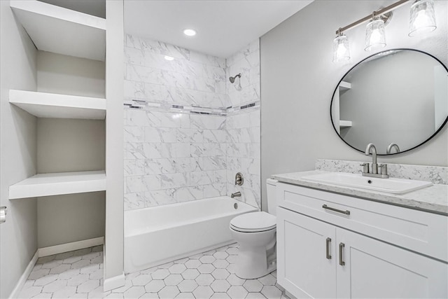 full bathroom featuring toilet, tiled shower / bath combo, vanity, and tile patterned floors