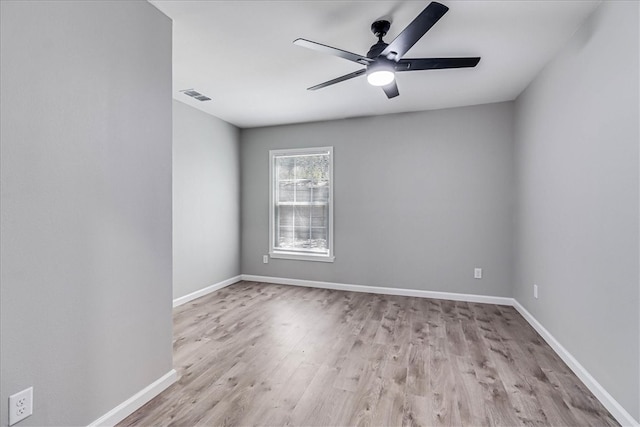 unfurnished room featuring light hardwood / wood-style flooring and ceiling fan