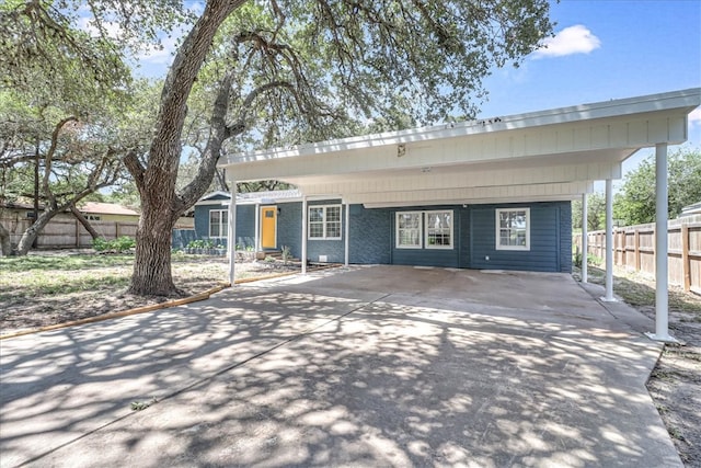 view of front of property featuring a carport