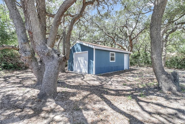 view of outbuilding featuring a garage