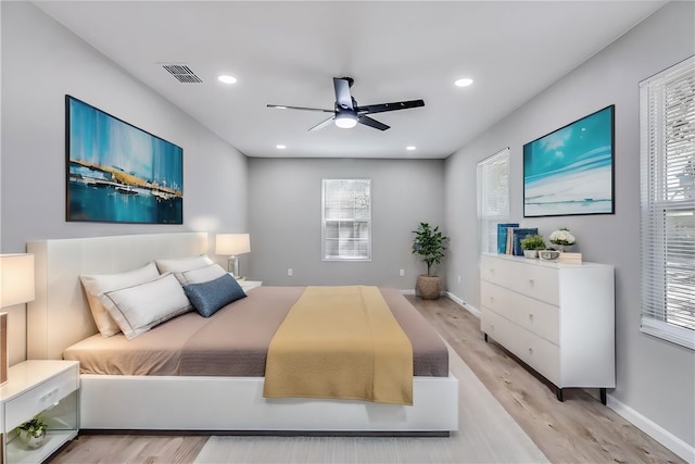 bedroom featuring ceiling fan and light hardwood / wood-style flooring