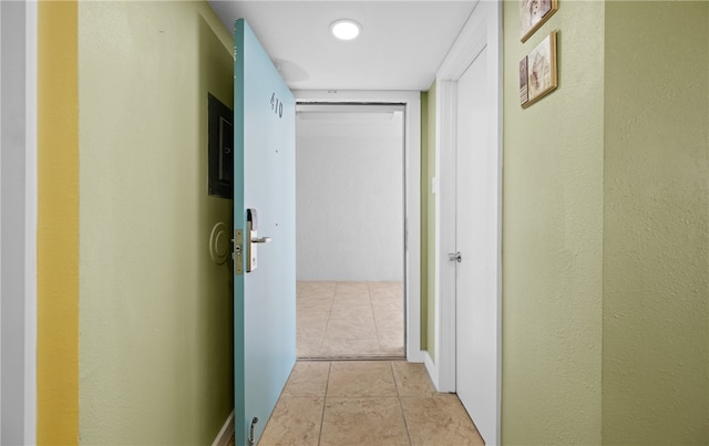 corridor with light tile patterned flooring