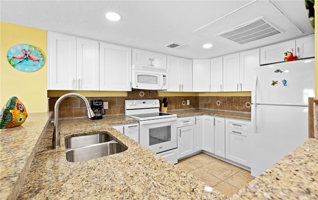 kitchen featuring white cabinetry, white appliances, sink, and decorative backsplash