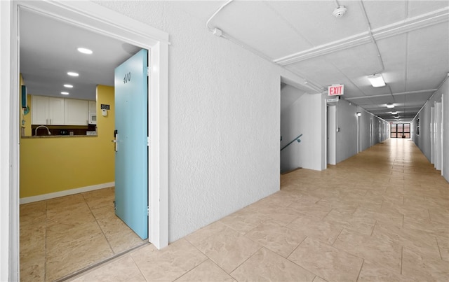 hallway featuring sink