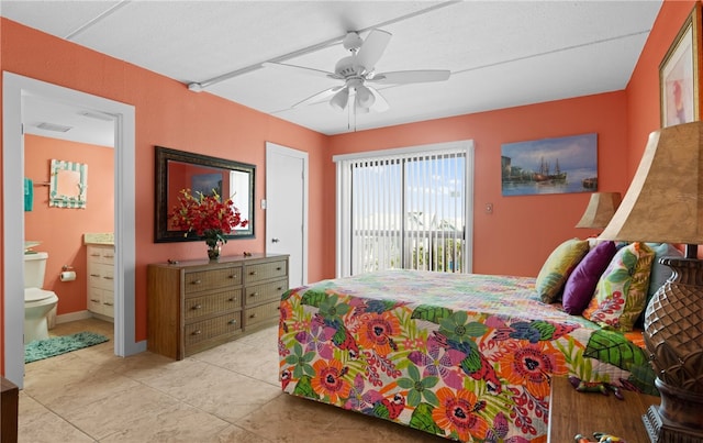 bedroom with light tile patterned floors, access to outside, ceiling fan, and ensuite bathroom