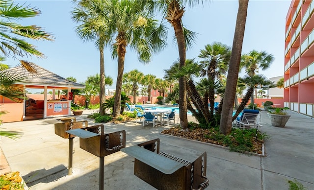 view of patio with a gazebo and a community pool