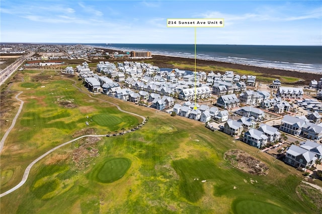 birds eye view of property with golf course view, a water view, and a residential view