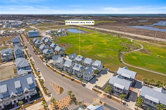 bird's eye view featuring a water view, a residential view, and golf course view