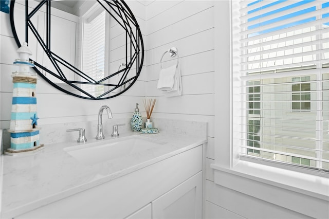 bathroom featuring plenty of natural light and vanity