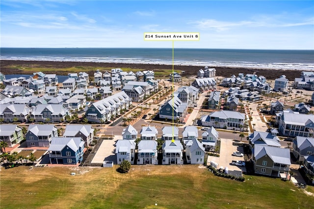 drone / aerial view with a residential view and a water view