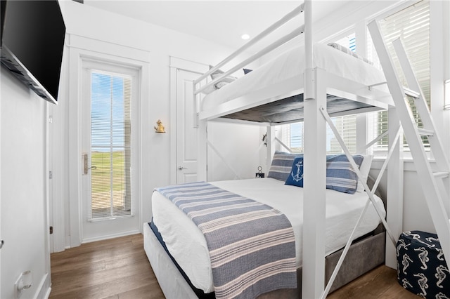 bedroom featuring recessed lighting, wood finished floors, and baseboards