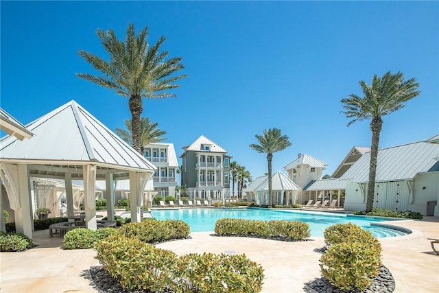 community pool featuring a gazebo and a patio area