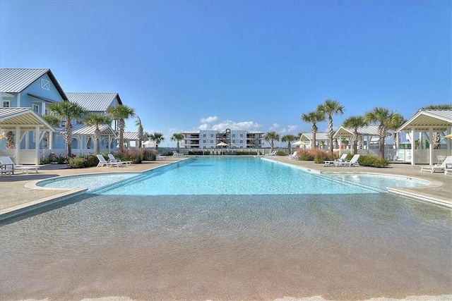 view of swimming pool featuring a patio area