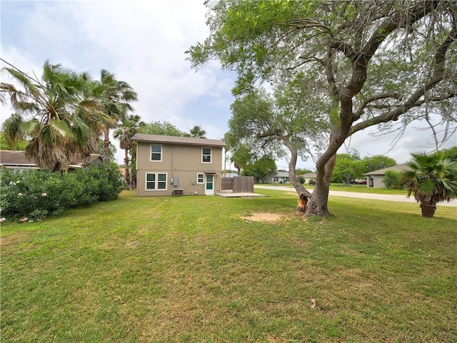 2746 Beaumont Ave, Ingleside, TX 78362 - rear view of house featuring a yard