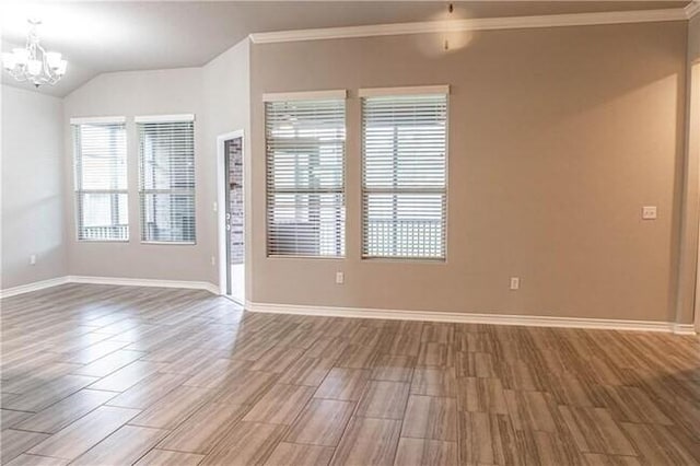 1020 Pasadena St, Portland, TX 78374 - spare room featuring a chandelier, baseboards, ornamental molding, wood finished floors, and vaulted ceiling
