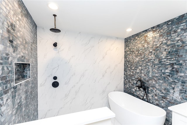 bathroom featuring tile walls and separate shower and tub