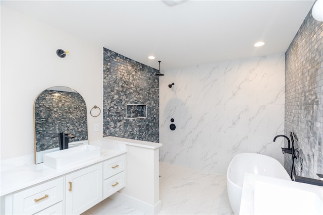 bathroom with tile walls, shower with separate bathtub, and vanity