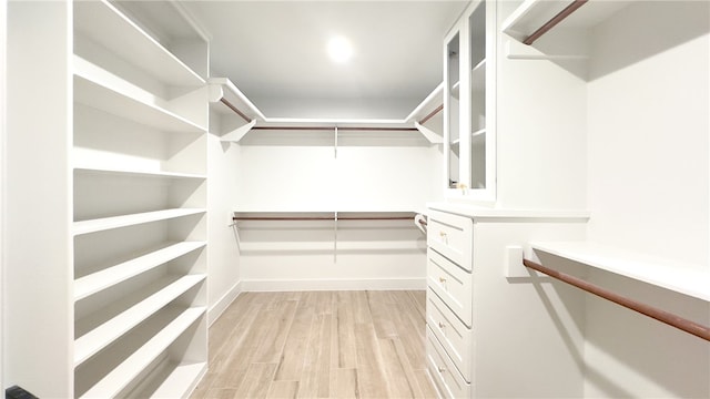 walk in closet featuring light wood-type flooring