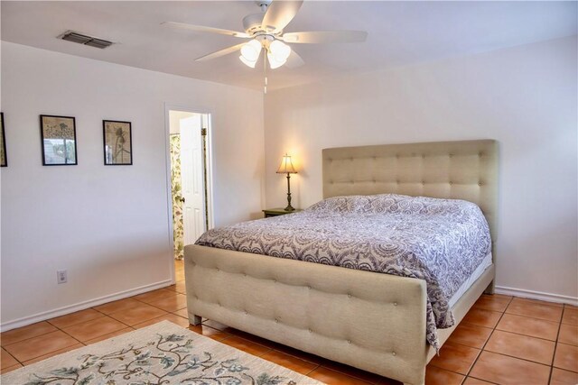 2821 Quebec Dr, Corpus Christi, TX 78414 - bedroom with tile patterned flooring, baseboards, a ceiling fan, and ensuite bathroom
