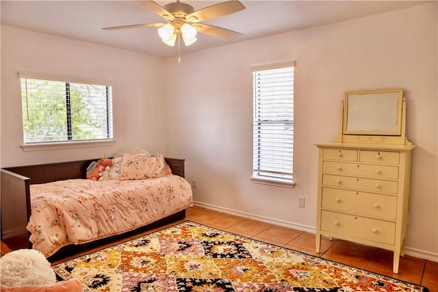 2821 Quebec Dr, Corpus Christi, TX 78414 - bedroom with light tile patterned floors, multiple windows, and baseboards