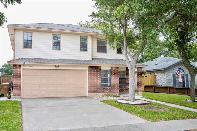 2821 Quebec Dr, Corpus Christi, TX 78414 - view of front facade with brick siding, a garage, concrete driveway, and a shingled roof