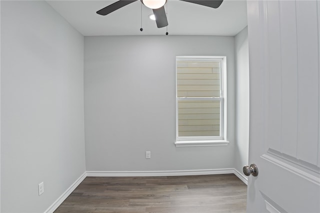 empty room featuring hardwood / wood-style flooring and ceiling fan