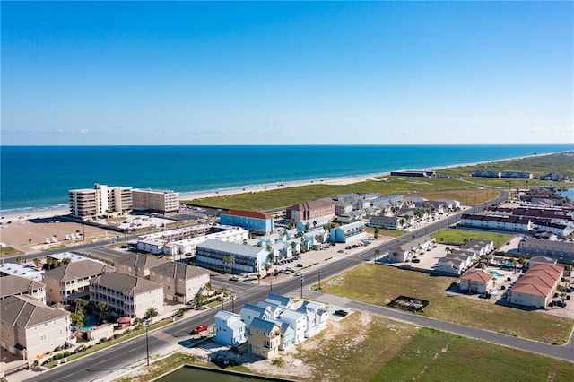 birds eye view of property with a beach view and a water view