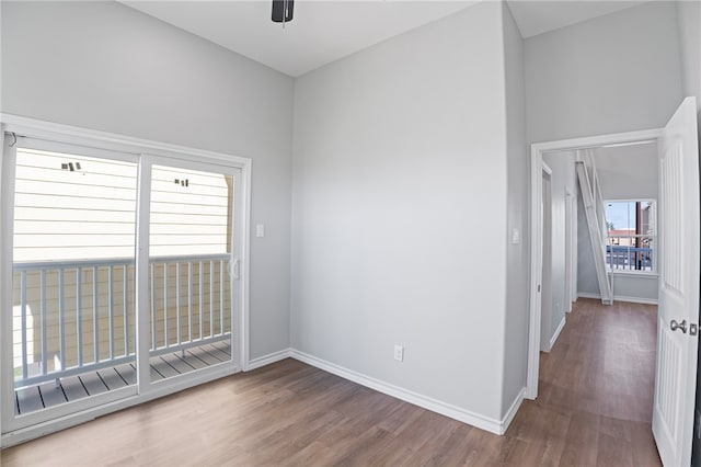 unfurnished room featuring hardwood / wood-style floors and ceiling fan