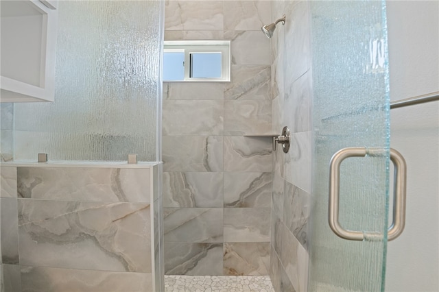 bathroom featuring an enclosed shower