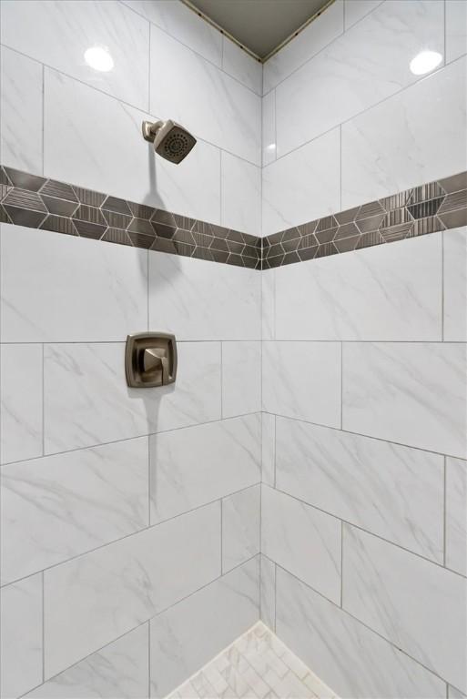 bathroom with a tile shower