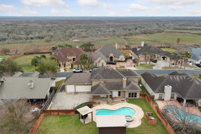 view of pool with a fenced in pool, a residential view, and fence