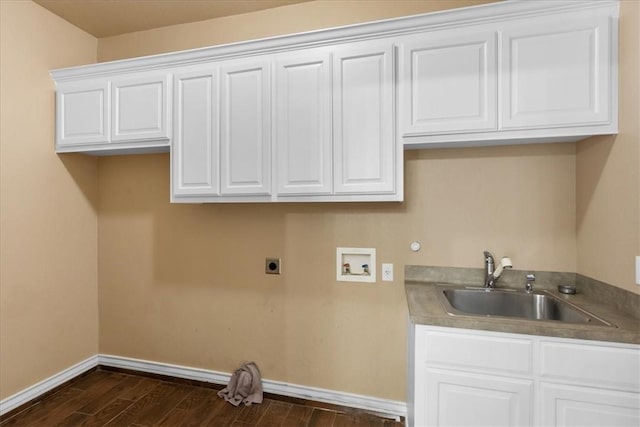 laundry room featuring hookup for a washing machine, hookup for an electric dryer, a sink, cabinet space, and dark wood finished floors