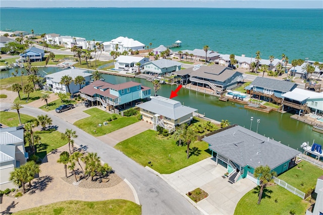 birds eye view of property featuring a water view