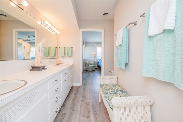 bathroom with hardwood / wood-style flooring and vanity