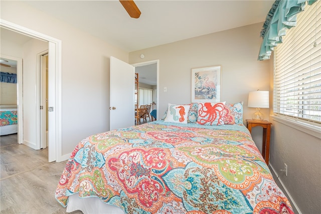 bedroom featuring light hardwood / wood-style flooring and ceiling fan