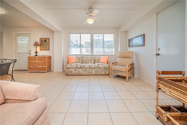 tiled living room featuring ceiling fan