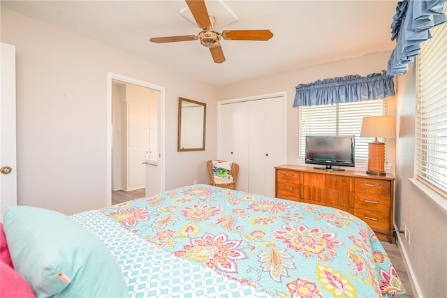 bedroom with ceiling fan and a closet