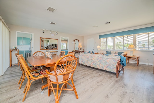 dining area with light hardwood / wood-style flooring