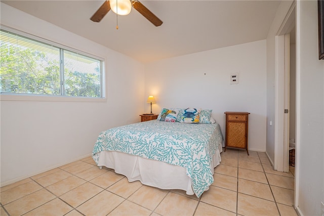 tiled bedroom with ceiling fan