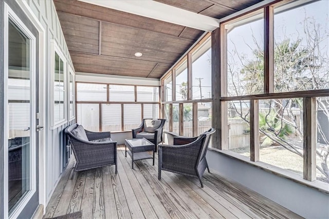 sunroom / solarium with lofted ceiling with beams and wood ceiling