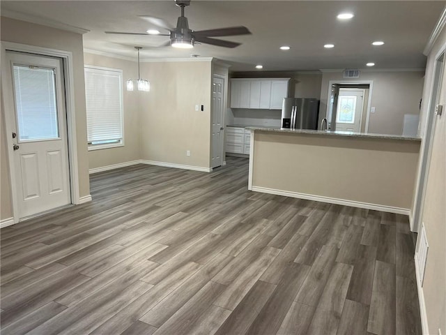 306 Circle Dr, Corpus Christi, TX 78412 - unfurnished living room featuring crown molding, a ceiling fan, baseboards, dark wood finished floors, and recessed lighting