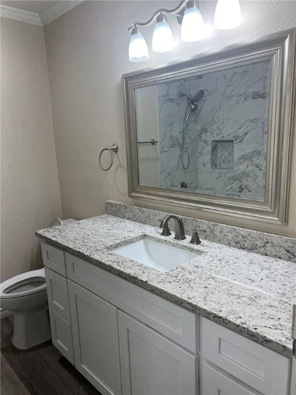 306 Circle Dr, Corpus Christi, TX 78412 - bathroom with ornamental molding, a shower, vanity, and toilet