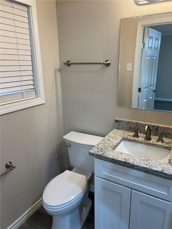 306 Circle Dr, Corpus Christi, TX 78412 - half bath featuring vanity and toilet