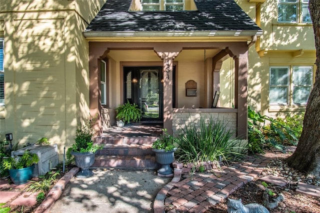 entrance to property featuring a porch