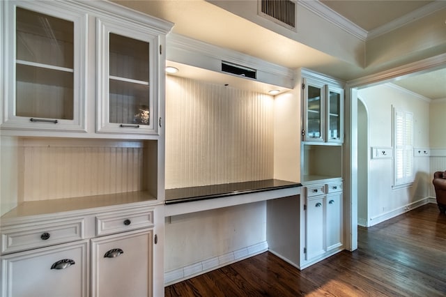 kitchen with white cabinets, dark hardwood / wood-style flooring, and crown molding